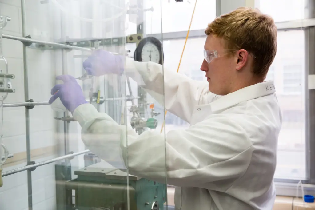 Kevin Barnett taking a sample in the lab.