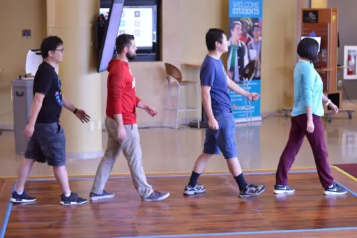 students walking across the flooring