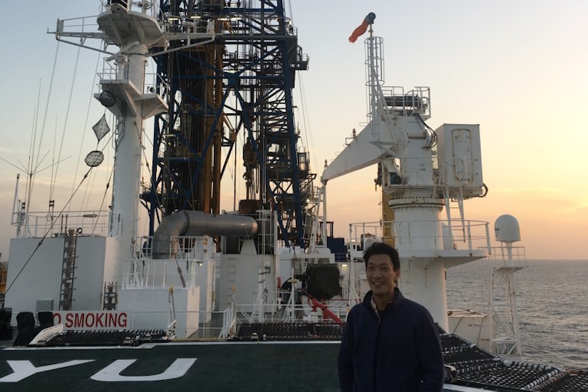 Photo of Hiroki Sone standing the drilling vessel