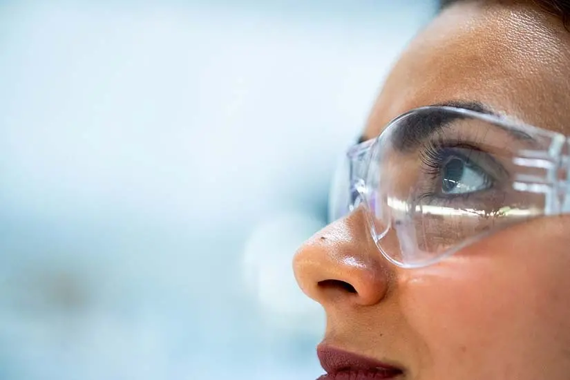 A woman wearing safety glasses