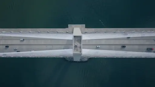 Drone photo looking down on large bridge