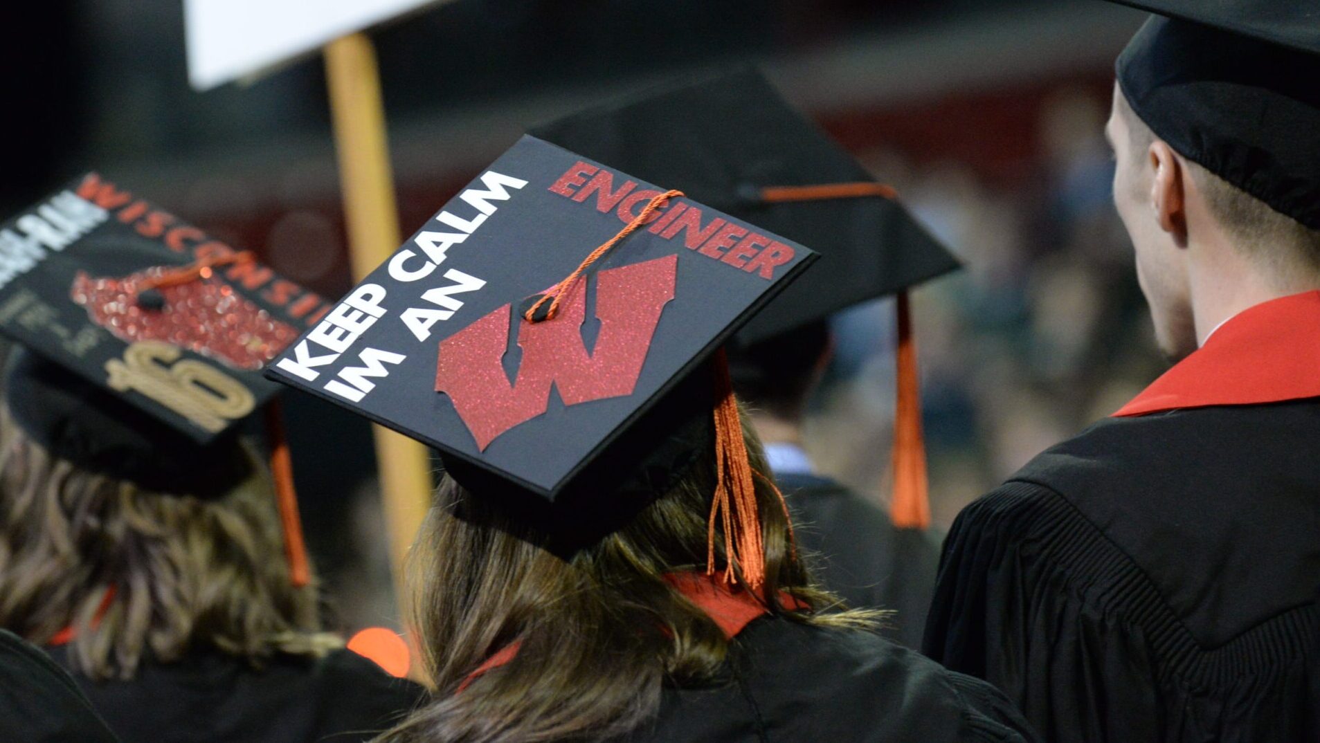 Back of a students cap at graduation with a W on it