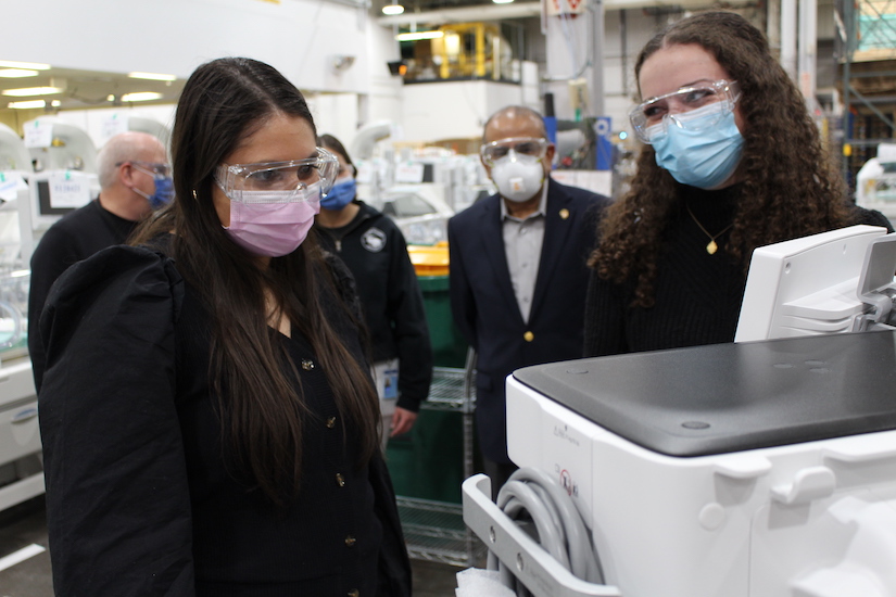 Students examine an anesthesia delivery unit at GE Healthcare