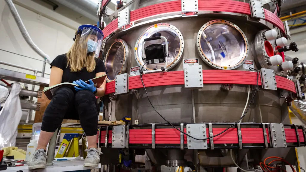Carolyn Schaefer, a PhD student in engineering physics, works on the Pegasus-III fusion experiment