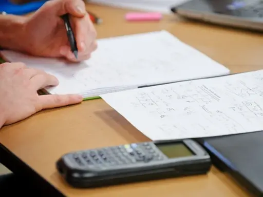 Person working on engineering calculations.