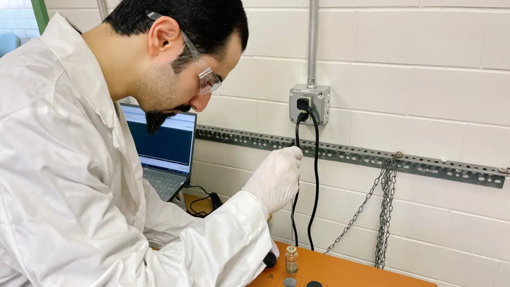 Researcher Payam Hosseini working in lab