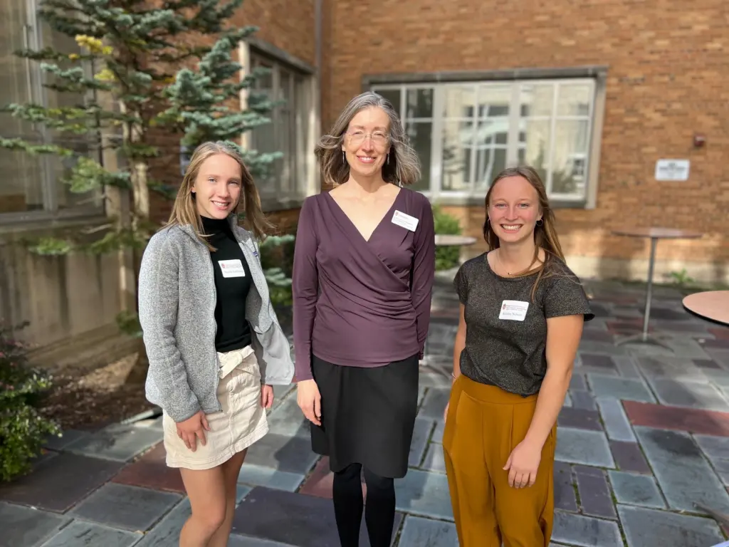 ECE Department Chair Susan Hagness poses with two undergraduate scholarship recipients in the Engineering Hall courtyard