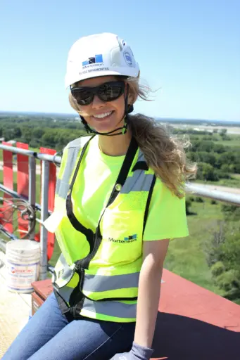 Elyse Miramontes on top of a tower crane during her internship with Mortenson.