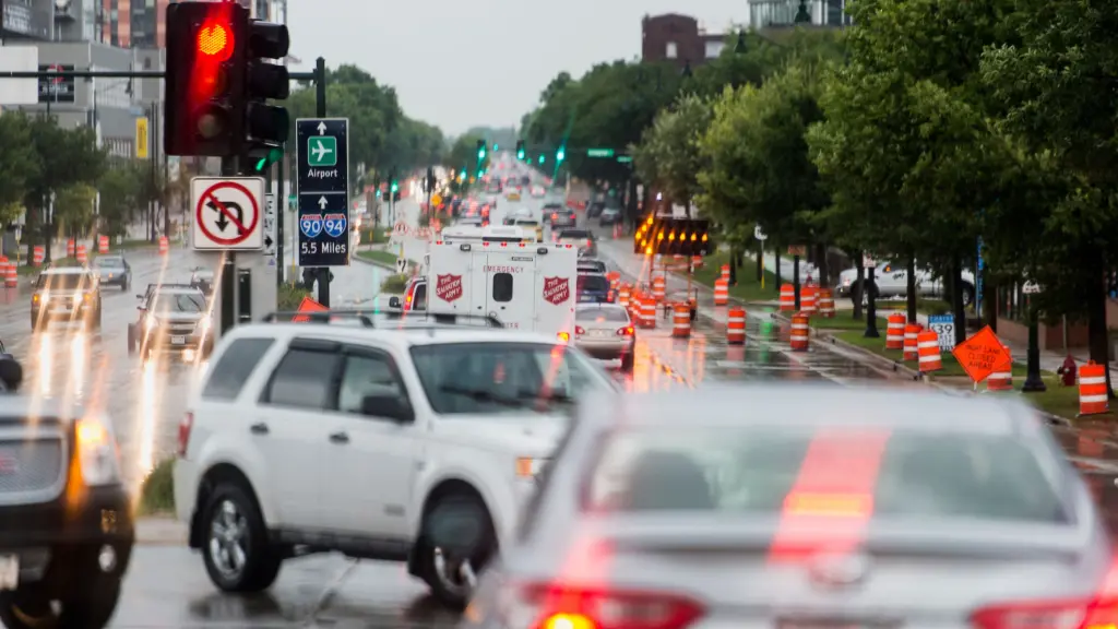 Vehicular-traffic becomes congested along a partially-flooded section of East Washington Avenue in Madison, Wisconsin