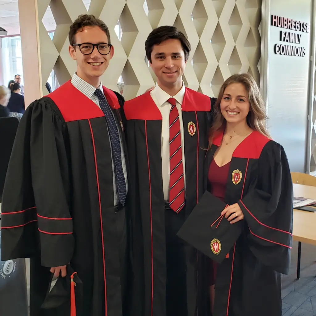 Three 2023 graduates in gowns