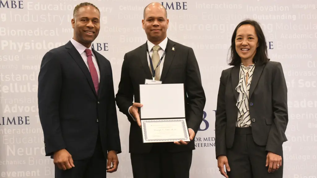 Associate Professor Randolph Ashton (middle) with AIMBE College of Fellows Chair Guillermo Ameer (left) and AIMBE President Joyce Wong.