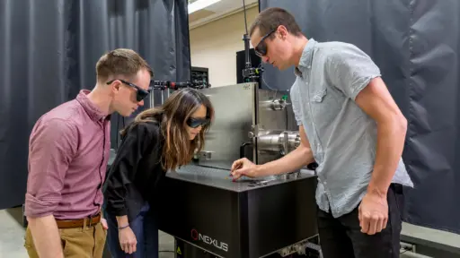 Eric Tervo, Jennifer Choy and Dakotah Thompson doing research in thermal photonics lab