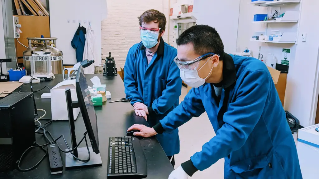 Patrick Sullivan (left) and Xiu Liang Lyu working on designing and synthesizing new organic molecules.
