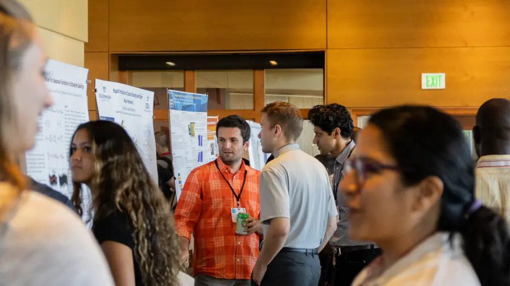 Ali Shahabi discusses his research with attendees at the YCSEC-A 2023.