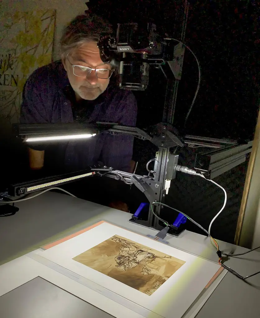Professor William Sethares uses the watermark imaging system (WimSy) to examine the Rembrandt painting "Return of the Prodigal Son"