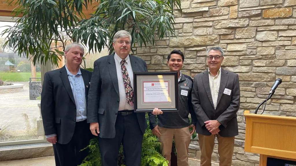 Greg Harrington, Karl Linck, Jorge Gutierrez, and Jan Kucher pose with the 2023 UW-Madison NCEES award during the Engineers' Day Luncheon at Olbrich Botanical Garden.