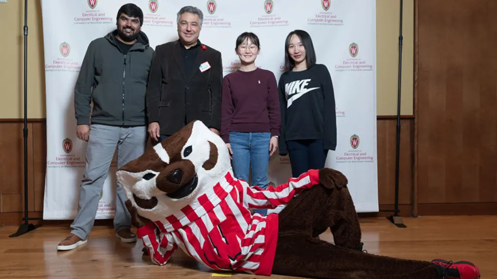 Bulent Sarlioglu with students and Bucky Badger
