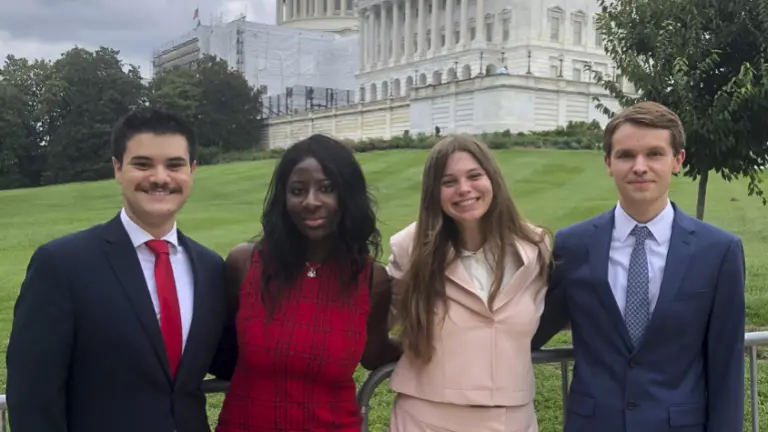 Evan Erickson with students Ryan Alimento, Aicha Sama, and Courtney Cochran