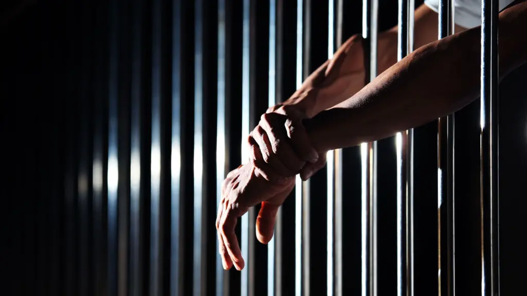 Hands sticking out of jail cell