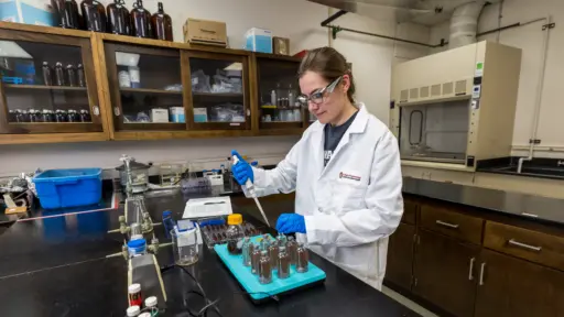 PhD student Jenna Swenson working in the lab