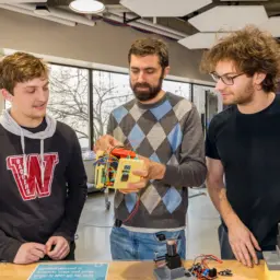 Students discuss a low-frequency magnetic beacon