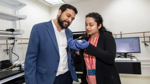 Assistant Professors Chirag Gupta and Shubhra Pasayat examine a new ultrawide-bandgap semiconductor material