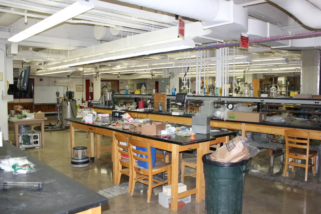 Summer lab space before reconstruction with old tables and chairs.