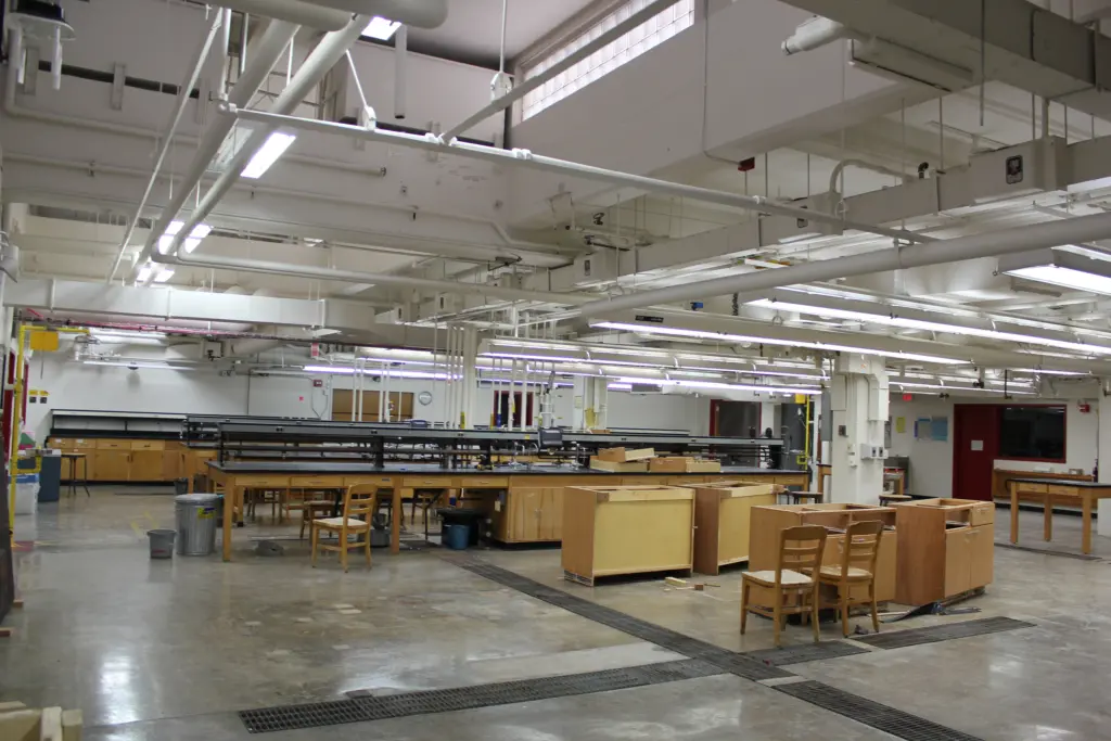 Old tables and chairs are being cleared out to make way for renovation of the new lab.