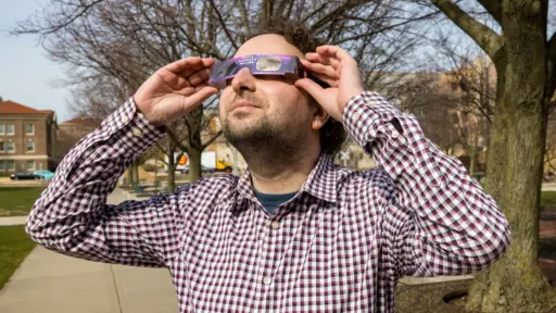 Mikhail Kats in eclipse glasses