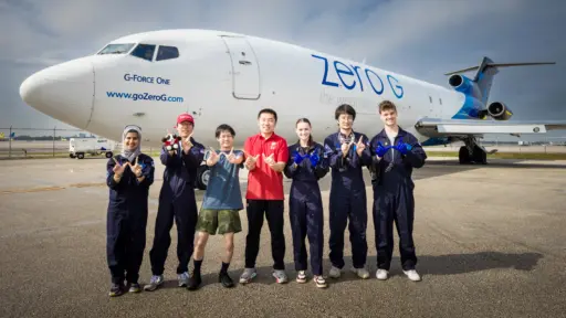 Qin lab in front of test flight plane