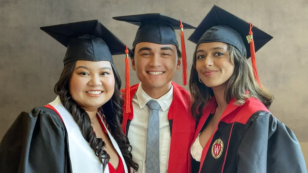 Three college of engineering graduates at the 2023 commencement
