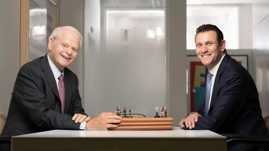 alumnus Scott Weisberg, left, sits with PML LLC founder Peter Lehrer