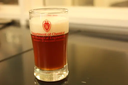 Tasting glass with Department of Chemical and Biological Engineering logo.