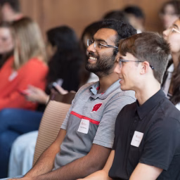 Students smiling at reception