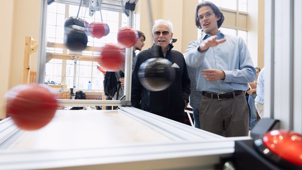 Bjorn Borgen with a student at the 2025 Mechanical Engineering Spring Design Showcase