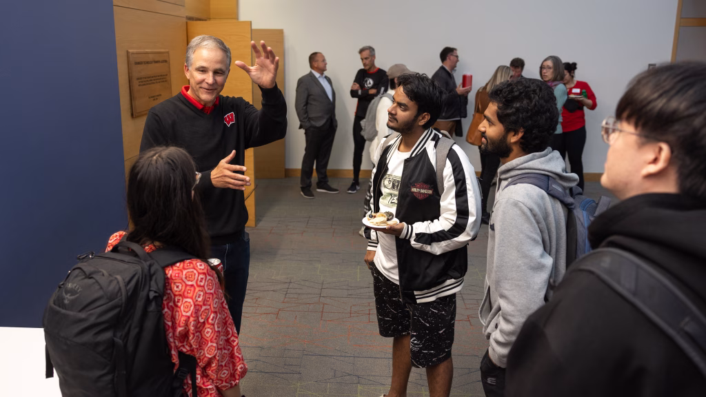 Alumnus Jim Thompson talks with students after the lecture