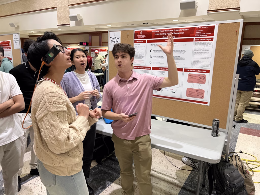 Student demonstrates smart glasses with faculty member