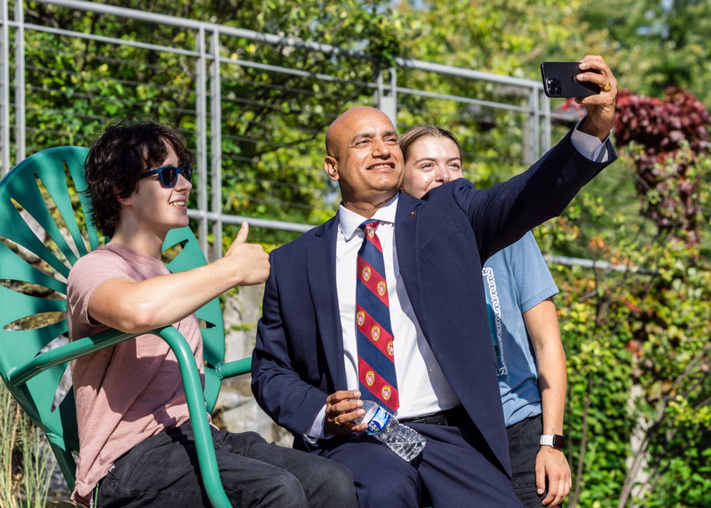 Grainger Dean Devesh Ranjan takes a photo with freshman students at 2025 Welcome event.
