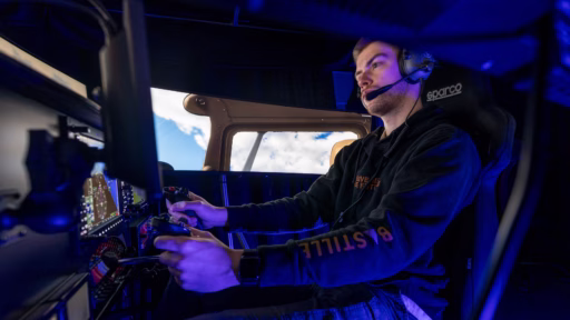 Teaching specialist Aidan Butula operates the new flight simulator