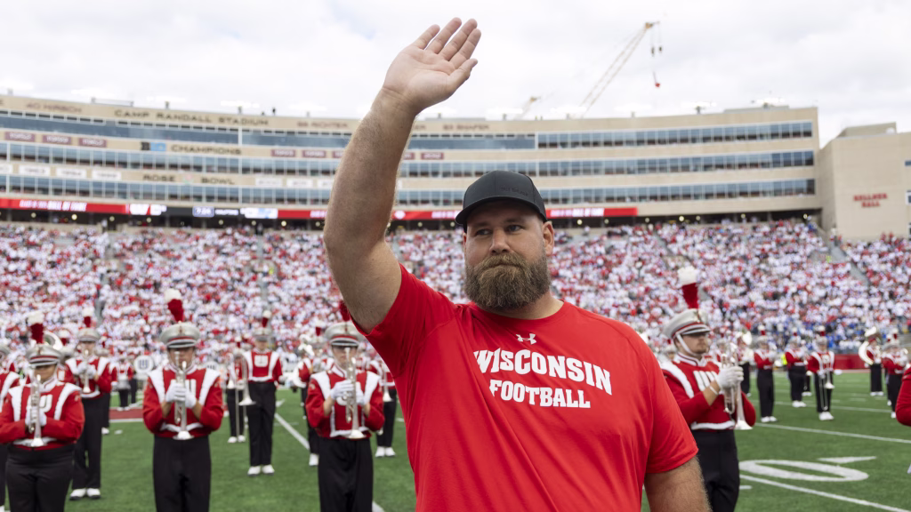 Travis Frederick waves to the crowd at Camp Randall Stadium