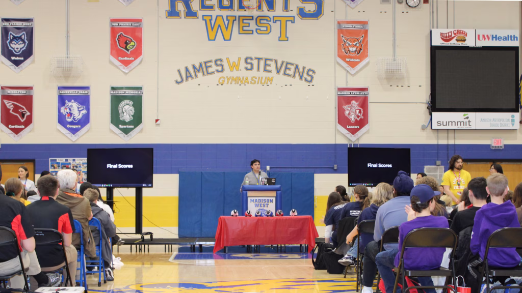 William Noguera stands before a crowd of students and supporters during the Badger Invitational.