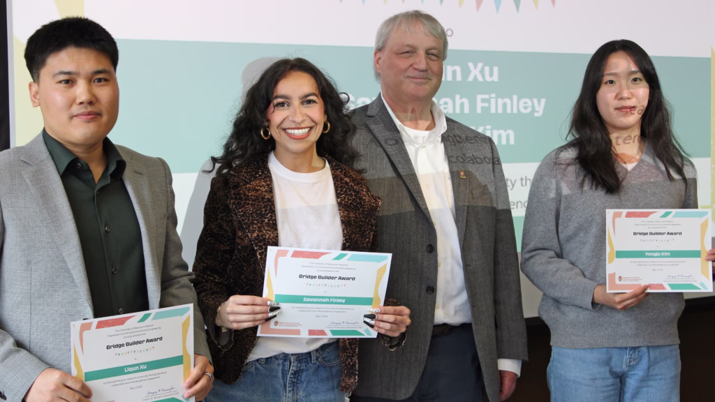 Three Bridge Builder Graduate Student Award winners with the Department Chair
