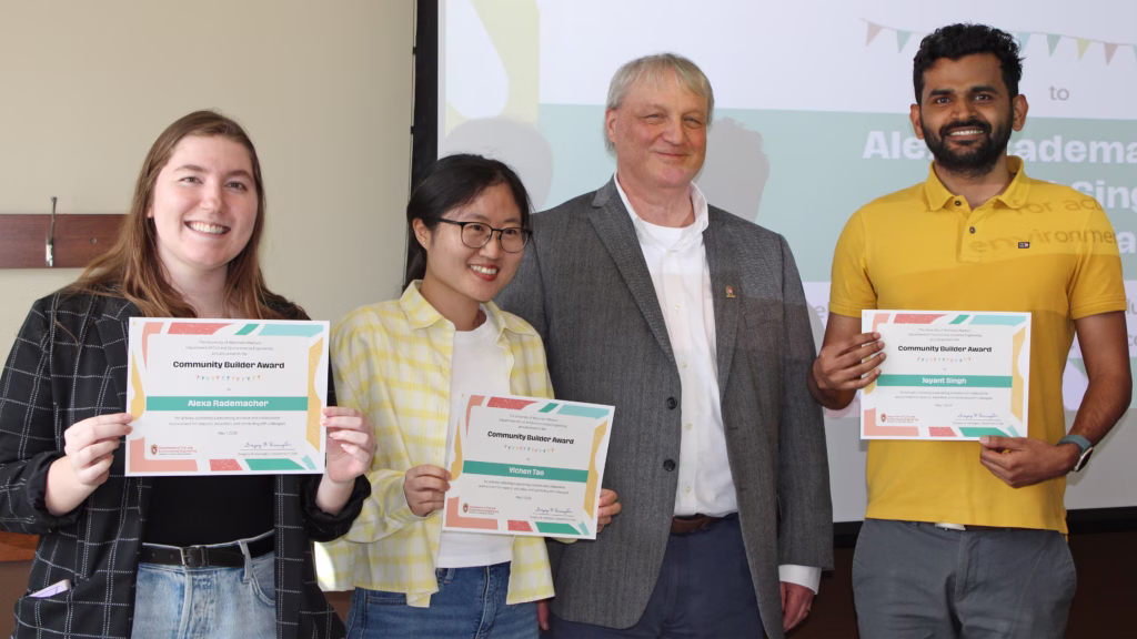 Three Community Builder Graduate Student Award winners and the Department Chair