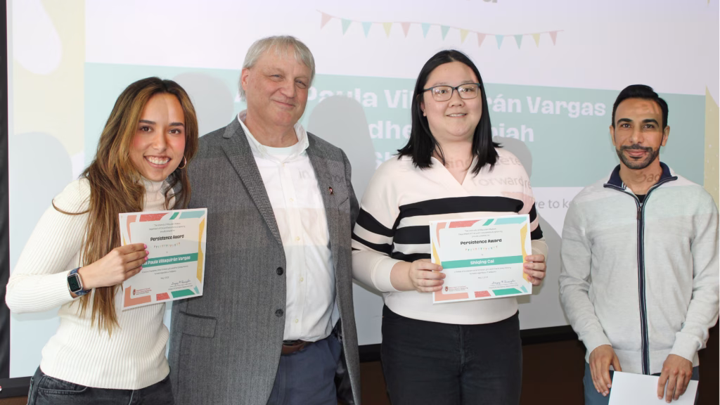 Three Persistence Graduate Student Award winners and the Department Chair