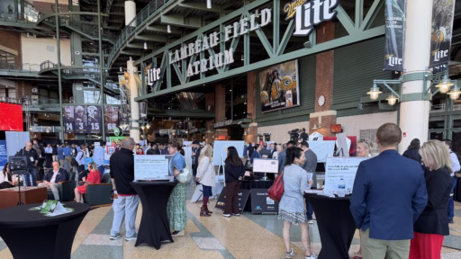 Attendees converse at the Wisconsin Drives Manufacturing Summit on June 1, 2026 at Lambeau Field