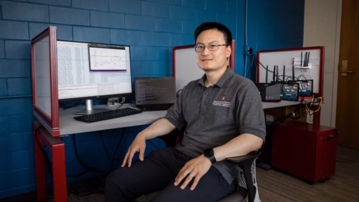 Feng Ye sitting in lab
