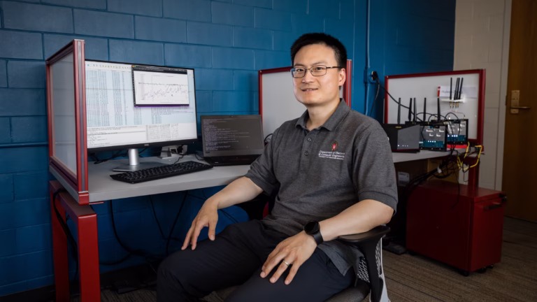 Feng Ye sitting in lab