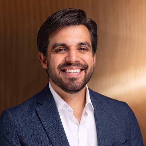 Headshot of Jeffrey Lopez. He has short brown hair, a beard and is wearing a blue blazer.