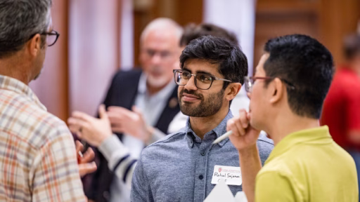 New faculty members converse