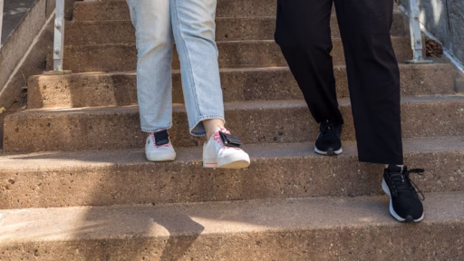 Graduate students walk down the stairs